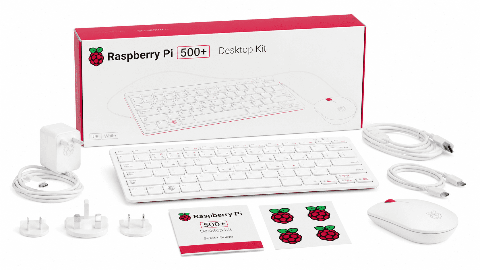Raspberry Pi 500+ Desktop Kit white keyboard mouse power adapter cables and setup guides beside the box