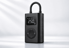 Portable digital tire inflator with a 250 BAR readout and circular control pad on a black body